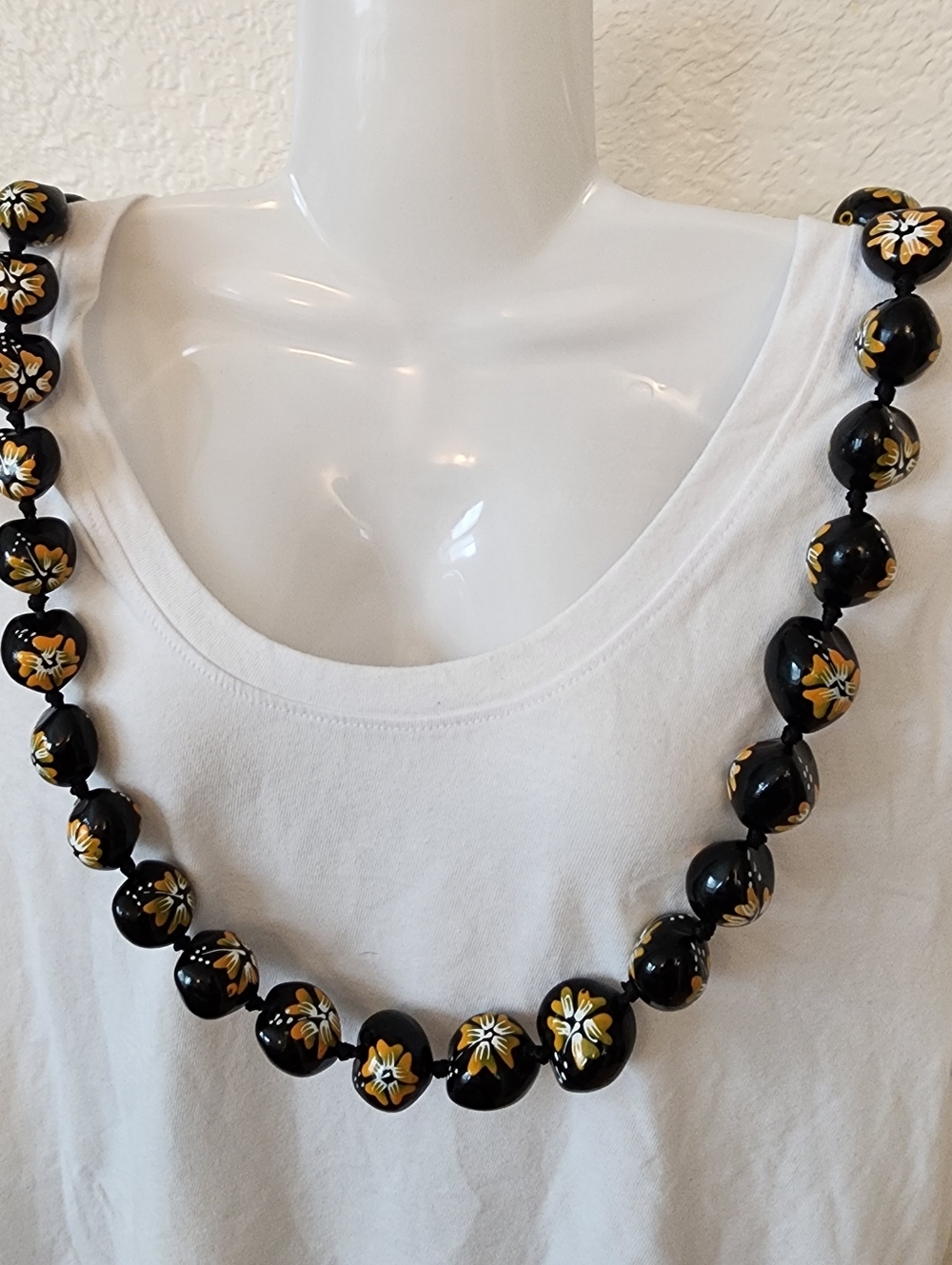 Hawaiian Kukui Nut Lei.  Hand-Painted Black and Gold Floral Accents.